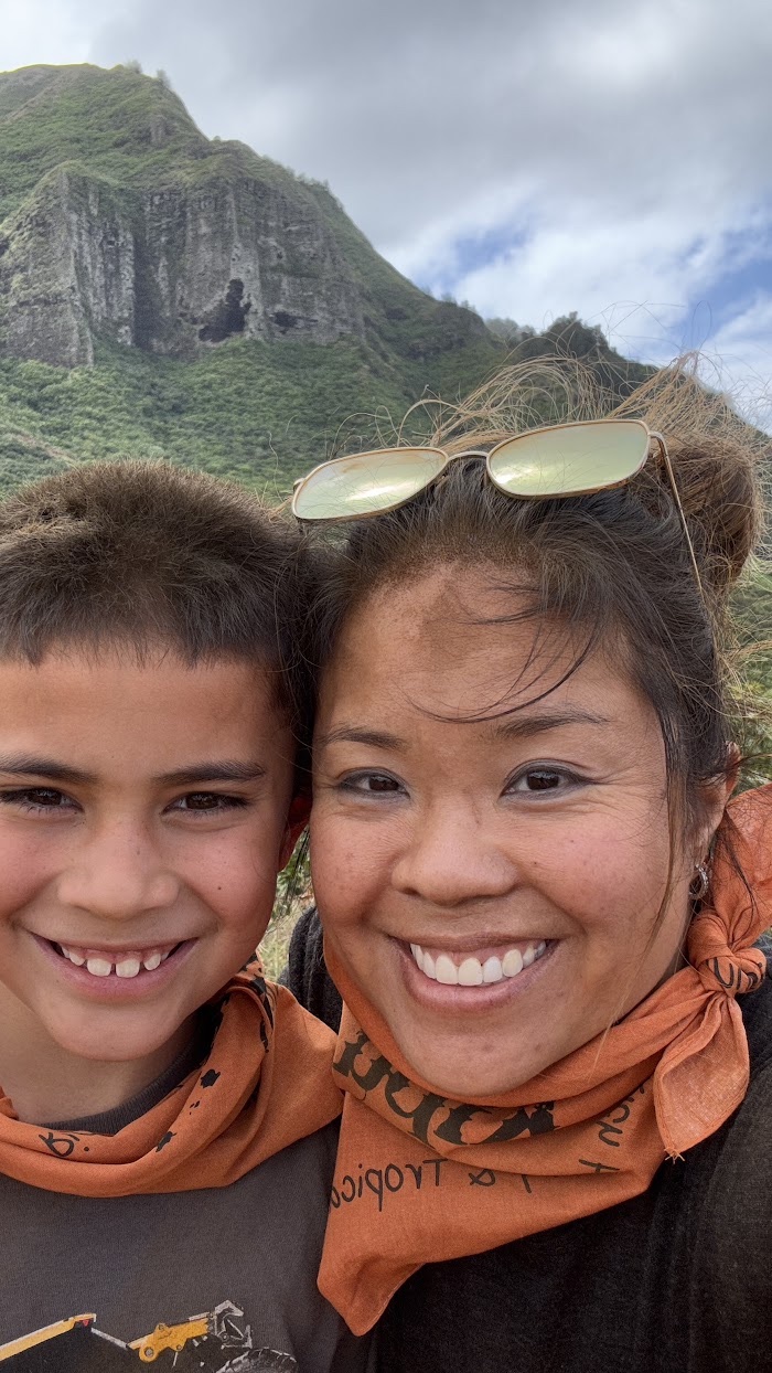 Seng and Conrad smiling together on a mountain hike